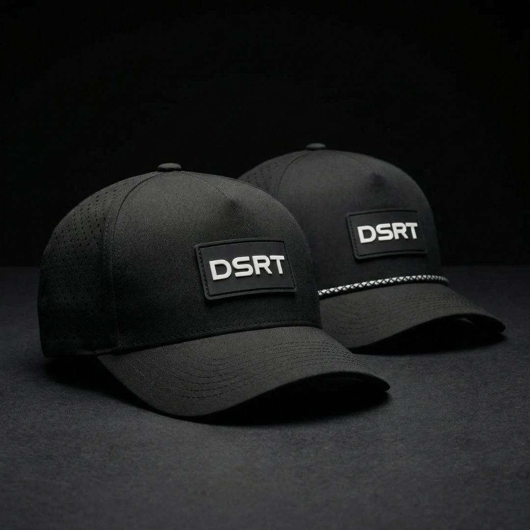 Two black caps with DSRT logo on a dark background