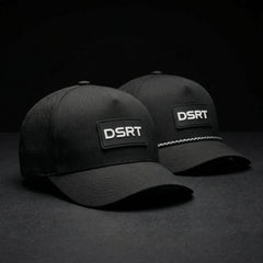 Two black caps with DSRT logo on a dark background